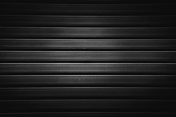 Metal grill with a rubber textured coating in black.Background.