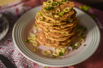 tasty breakfast in bed from eastern pancakes and Masala tea, served on the wood folding breakfast table