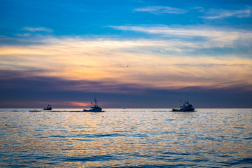 Fototapeta premium Lobster fishing boat scenery of Canada's Atlantic coast with a beautiful sky.