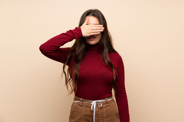 Teenager girl with glasses covering eyes by hands. Do not want to see something