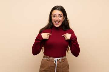 Teenager girl with glasses with surprise facial expression