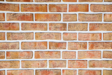 The brick wall of the cracked decorative brick is red .Texture.Background.