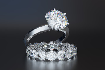 Solitaire diamond engagement rind, eternity wedding band, on gray glossy background