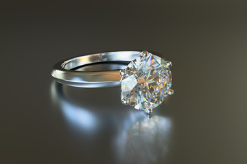 Solitaire diamond engagement rind on gray glossy background