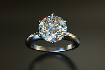 Solitaire diamond engagement rind on gray glossy background