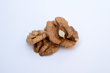Isolated nuts pattern white backdrop. Close-up of walnut kernels.