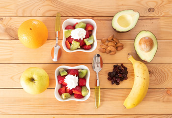 Healthy breakfast or break with a lot of fruits fresh and dried. Just a little cream to better enjoy the meal
