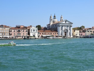 Fototapeta na wymiar View of Venice, Italy and its other architecture from the Grand canal, clear day