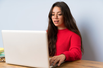 Teenager student girl studying in a table