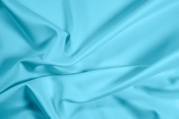 Closeup of rippled light blue satin fabric