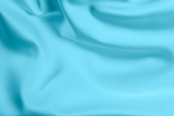 Closeup of rippled light blue satin fabric