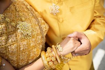 The Khmer couple keep their hand when they take photo pre wedding to prepare their wedding party