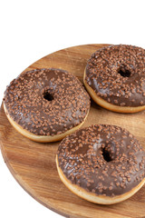 Donut With Chocolate Topping Cream On The Wooden Board