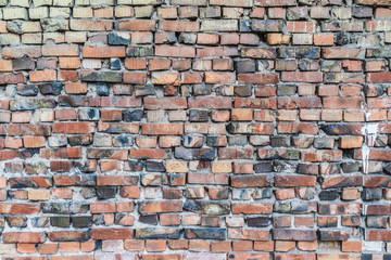 Background with the old shabby brick wall