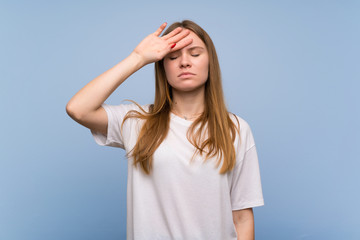 Young woman over blue wall with tired and sick expression