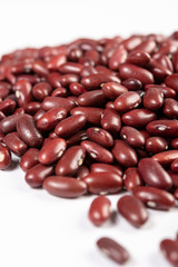 Closeup Of Raw Red Beans Above White Background