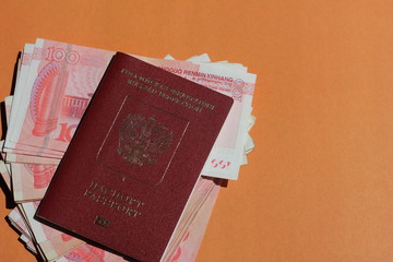 Biometric russian passport and yuan. Tourism, travel and international relations concept.