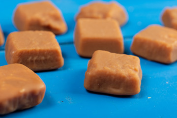 Brown Caramel Candies On The Blue Wooden Boards