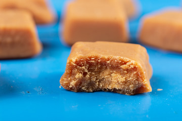 Brown Caramel Candies On The Blue Wooden Boards