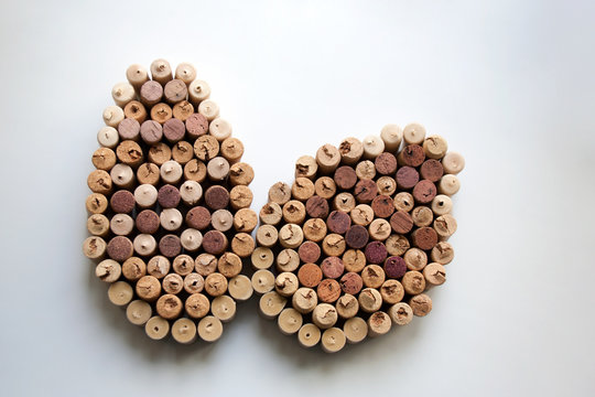 Wine corks Easter eggs abstract composition isolated on white background from a high angle view