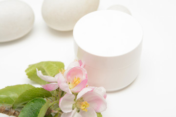Beauty product container with blossom and nature theme