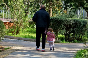 beautiful background where dad walks with his baby