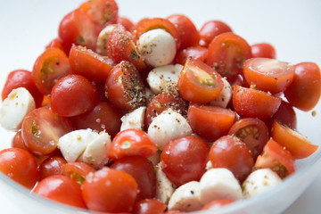  Home cooking. Salad of cherry tomatoes and mozzarella with spices.