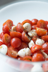  Home cooking. Salad of cherry tomatoes and mozzarella with spices.