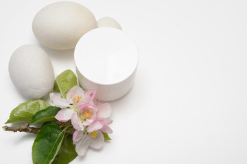 Beauty product container with blossom and nature theme