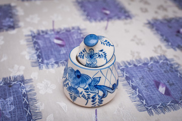 Beautiful colorful bowl for sugar on table