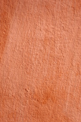 Abstract orange background texture rare vintage cement wall.  