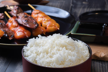 close up of steamed rice with grilled chicken