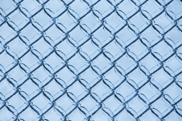 Fototapeta premium Abstract background with ice on metal fence