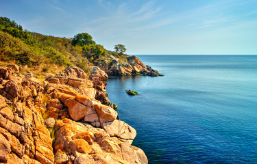 Beautiful landscape with rocky shore and blue sea