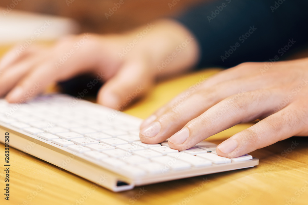 Poster sideview of man hands using keyboard