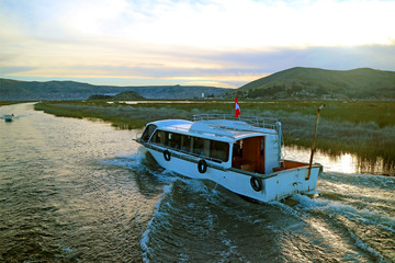 Naklejka premium Cruise Boat on Lake Titicaca, the Highest Navigable Lake in the World, Puno, Peru