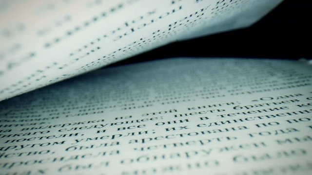 4k Macro Close-up Through a Russian Book Inside