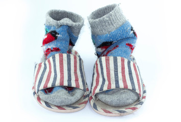 Colorful handmade socks, knitted wool socks and Slippers on white background.