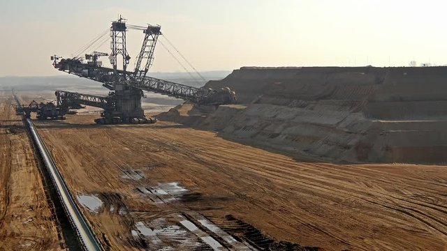 Bucket-wheel excavator in open-cast mining pit in Germany