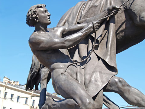 Sculpture fragment "Taming of a horse" on Anichkovy Bridge. St. Petersburg
