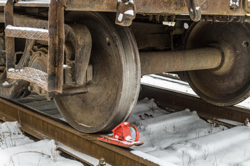 Fototapeta na wymiar Railway brake shoe under the train wheel on the rails