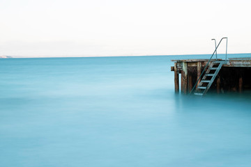 Obraz premium Beach, water and jetty