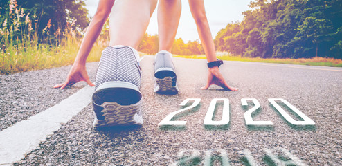 2019 symbolises the start into the new year.Start of people  running on street,with sunset...