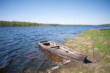 Naklejka na ściany i meble Boat on the Lake