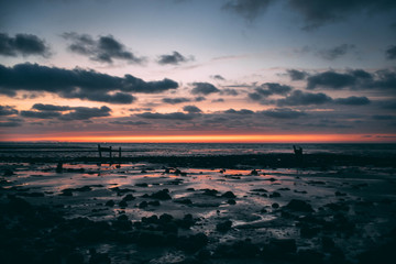 After sunset on an abandoned coast in England closing a beatiful day with a view at the smooth...