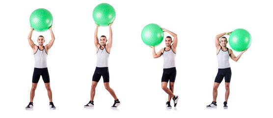Man with swiss ball doing exercises on white