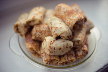 Delicious baked stuffed pancakes in a glass dish.