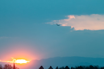 taking off plane on sunset blue sky background