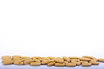 pills scattered on white background