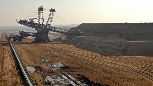 Bucket-wheel excavator in open-cast mining pit in Germany